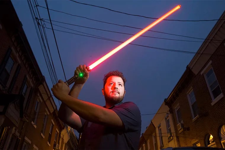 Jonathan Rossi, 28, who says he's been a &quot;Star Wars&quot; fan forever, launched a lightsaber business to coincide with the series' revival.
