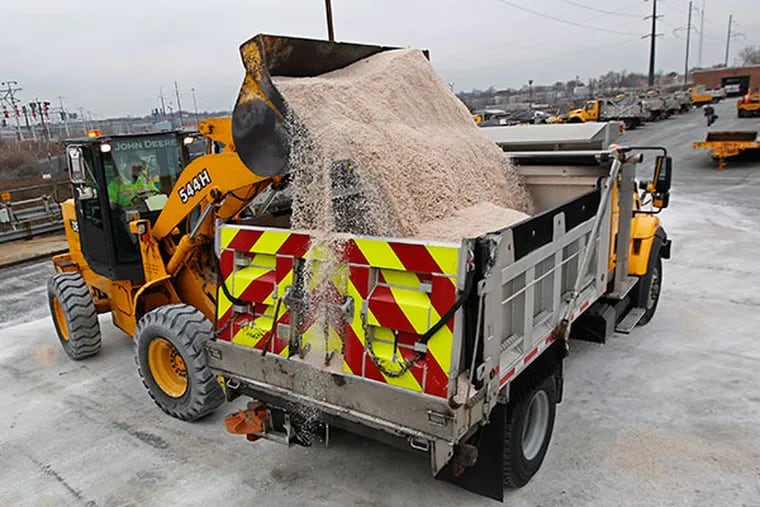 PennDot workers load up trucks with salt in preparation for a storm coming to the Philadelphia area. (Michael Bryant / Staff Photographer)