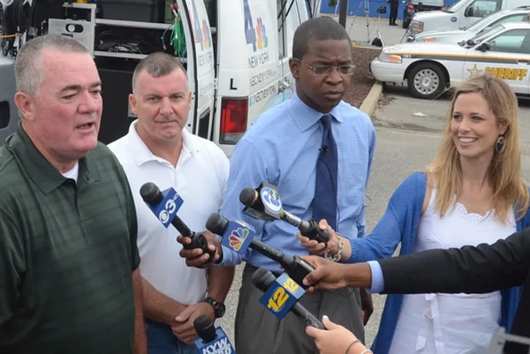 A $448 million Powerball jackpot was hit by three tickets in early August 2013. New Jersey sold two of them, including one bought for 16 workers at the Ocean County Vehicle Services Department. Its director, James Pine (green shirt) spoke with the media on Aug. 9, 2013. (Tom Kelly lll / For the Inquirer)