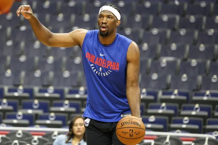 Joel Embiid warms up before a game against the Washington Wizards at the Capital One Arena in Washington, D.C., on Wednesday.