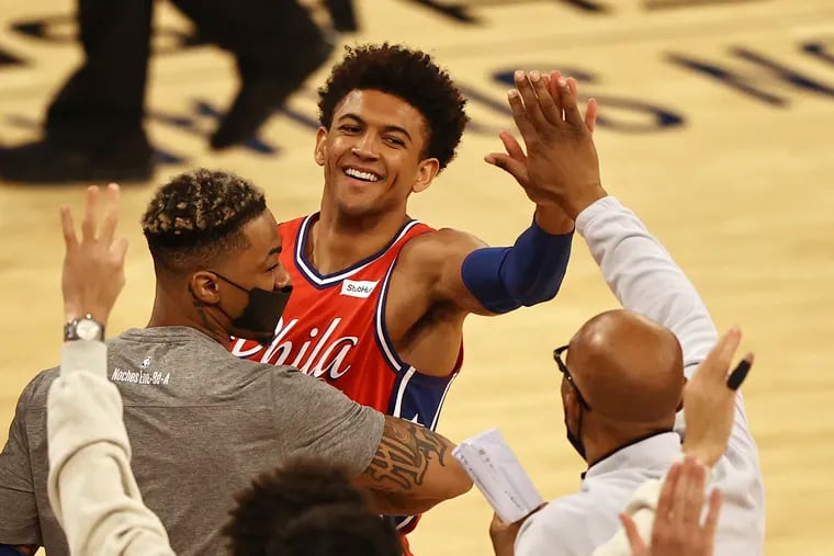 The Sixers' Matisse Thybulle, top, is congratulated as they go into a timeout in the second half against the New York Knicks.