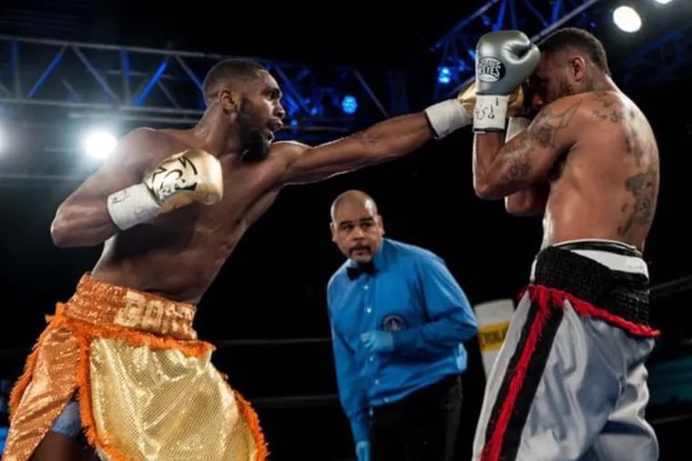 Philadelphia native boxer Jaron "Boots" Ennis, left, is an up-and-coming star in the welterweight division.
