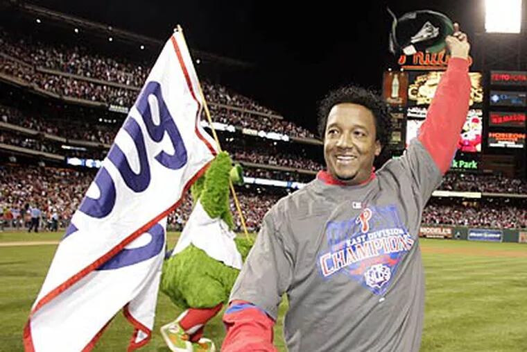 Pedro Martinez celebrated with fans after helping the Phillies clinch their third straight NL East title. (Yong Kim/Staff Photographer)