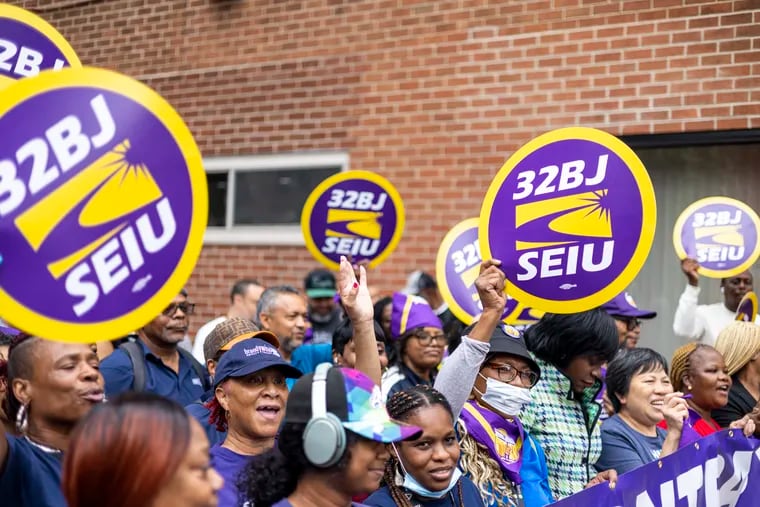 32BJ SEIU union members cheered at the announcement of a new contract deal that averted a strike outside Chestnut Street's First Unitarian Church of Philadelphia on Friday.