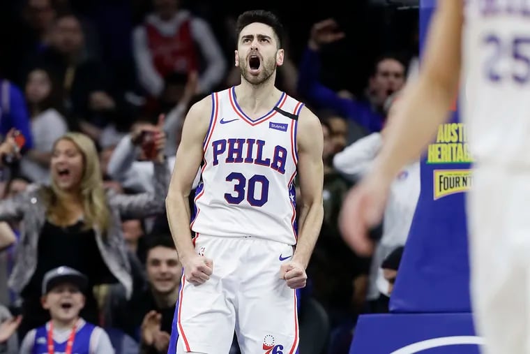 Sixers guard Furkan Korkmaz yells after dunking the basketball against the Chicago Bulls on Feb, 9,