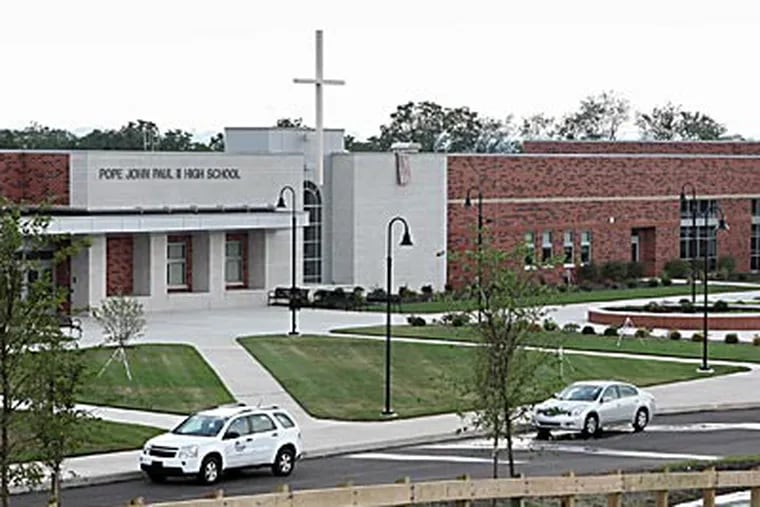 Pope John Paul II High School has two gyms and a 1,200-seat auditorium. An archdiocesan official said technology ensured the school would be competitive with the best public and private schools. (DAVID M WARREN / Staff Photographer)
