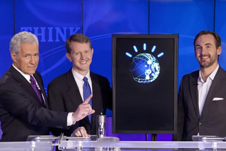 Host Alex Trebek (left) is joined by the contestants: From left, Ken Jennings, an "avatar" for IBM's Watson, and Brad Rutter. (Jeopardy Productions Inc.)