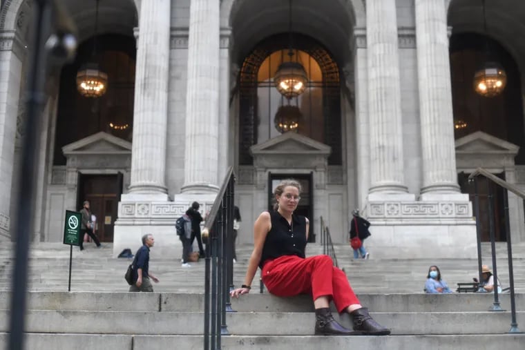 Kate Barnes, a Latin and Classic scholar, outside the New York Public Library. She is working on her PhD at Bryn Mawr College and has curated an exhibit there of Latin doodles and marginalia in ancient books.