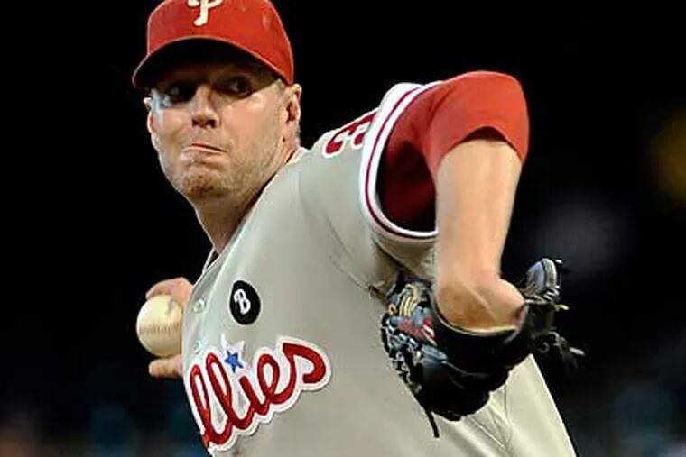 Roy Halladay pitched a complete-game shutout to clinch a playoff berth for the Phillies. (Pat Sullivan/AP)