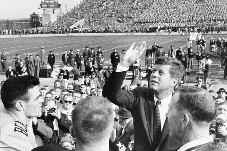 John F. Kennedy at the coin toss of the 1961 Army-Navy game. (File photo)