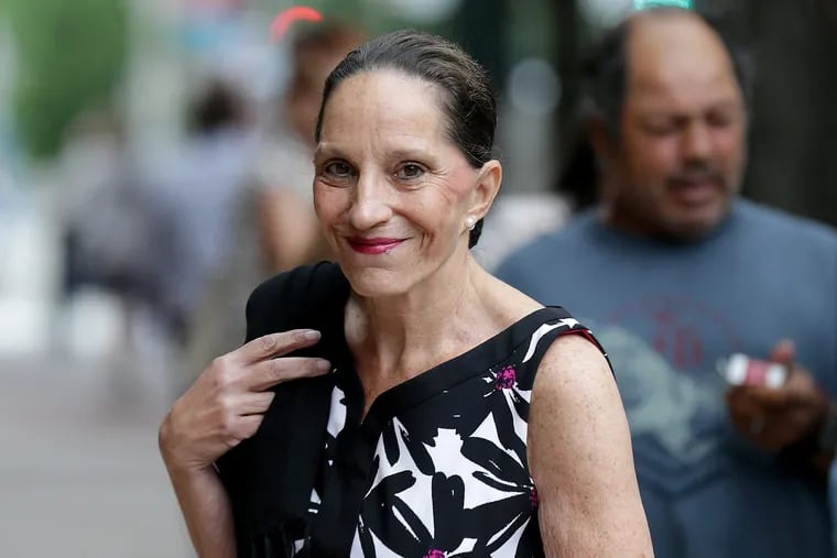 Renee Tartaglione walks into the federal courthouse in Philadelphia on Wednesday to be sentenced for fleecing more than $2 million from a publicly funded mental health and addiction treatment clinic she ran with her husband, Carlos Matos, in one of the neighborhoods hardest hit by the city's opioid epidemic.