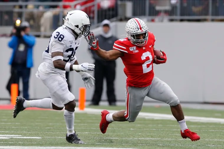 Ohio State running back J.K. Dobbins, right, cut up field against Penn State defensive back Lamont Wade during a game Nov. 23, 2019, in Columbus, Ohio.