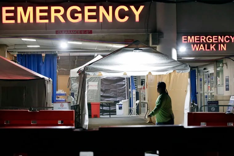 Portable medical tents are set up outside of The Hospital of the University of Pennsylvania (HUP) emergency room in Phila., Pa. on March 25, 2020. The University of Pennsylvania Health System is among those eligible to participate in a Pennsylvania Treasury bond buying program to help relieve financial stress on the industry.