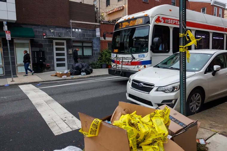 The scene along S. 17th Street, just above South Street, in Graduate Hospital on Tuesday, Sept. 26, 2023, after a bus driver found an unconscious shooting victim in the driver's seat idled Prius late Monday night.