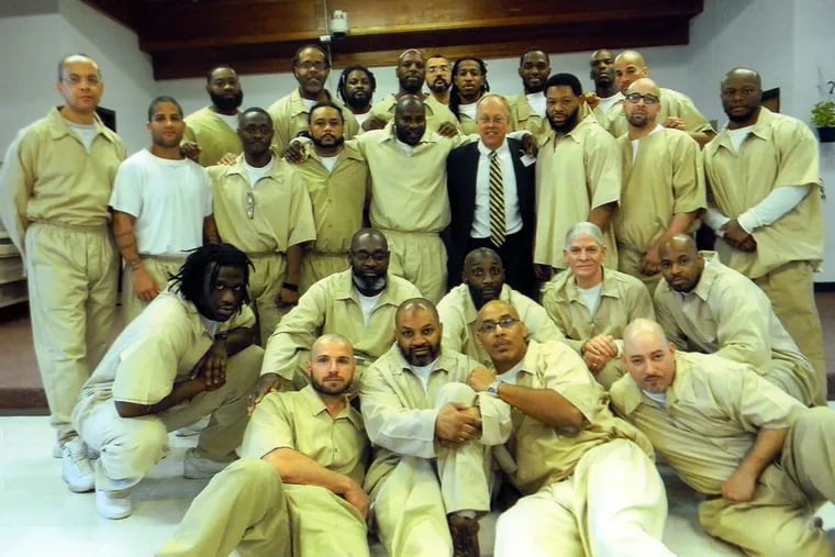 Chris Hedges (in tie) with the East Jersey State Prison inmates who collaborated to write “Caged,” world premiering through May 20 at Passage Theatre in Trenton, N.J.