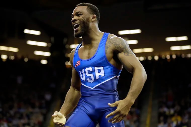 In a 2016 file photo, Jordan Burroughs celebrates after a victory at the U.S. Olympic Wrestling Team Trials, in Iowa City, Iowa.