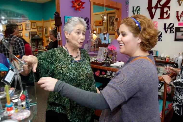 An owner, Elayne Aion (left) chats with customer Shahrzad Kojouri, from Ardmore, Pa., on Saturday. (Akira Suwa /  Staff Photographer)