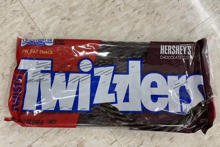 A suit says that Good & Plenty and black Twizzlers contain an ingredient that could be bad for your health.