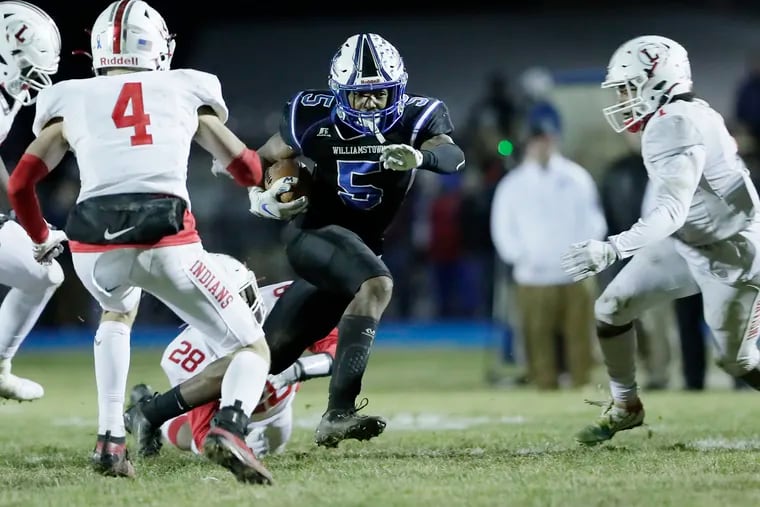 Williamstown running back Turner Inge carries the ball in the fourth quarter of the South Jersey Group 5 championship game Friday against Lenape. Williamstown came from behind to beat Lenape, 14-10, on its home field at Williamstown High School.