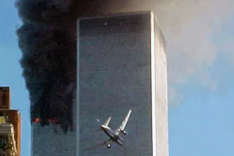 In this Sept. 11, 2001 file photo, American Airlines Flight 175 closes in on World Trade Center Tower 2 in New York, just before impact.