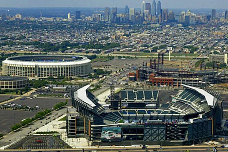 Lincoln Financial Field, foreground, which became the new home of the Eagles in 2003, is shown with other sports complex buildings, including Veterans Stadium (before it was knocked down) and Citizens Bank Park, the Phillies' new ballpark. (AP Photo/George Widman)