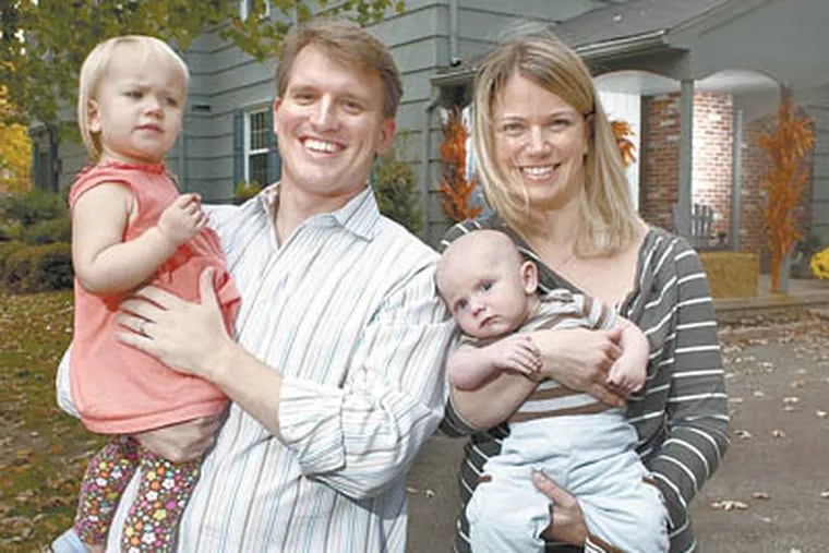 Ryan and Jenna Tickner with their children Reagan, 2, and Wyatt, 2 months. (Ed Hille / Staff Photographer)