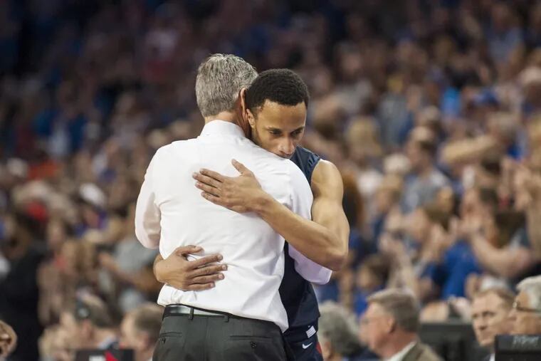 Penn Quakers head coach Steve Donahue hugs Penn Quakers guard Darnell Foreman (4) at the end of the First Round game against the Kansas Jayhawks in the 2018 NCAA Men's Basketball Tournament Thursday, March 15, 2018 at Intrust Bank Arena in Wichita, Kan.