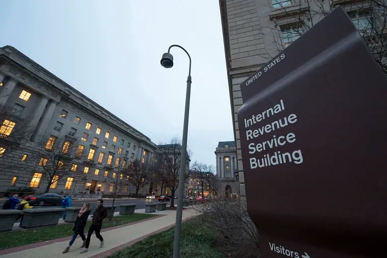 Workers enter the IRS building on Dec. 11, 2014, in Washington, D.C. A new IRS website can help get Americans their stimulus payment more quickly.