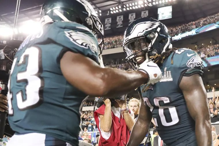 Eagles running back Jay Ajayi celebrates his fourth quarter touchdown run with teammate Darren Sproles.