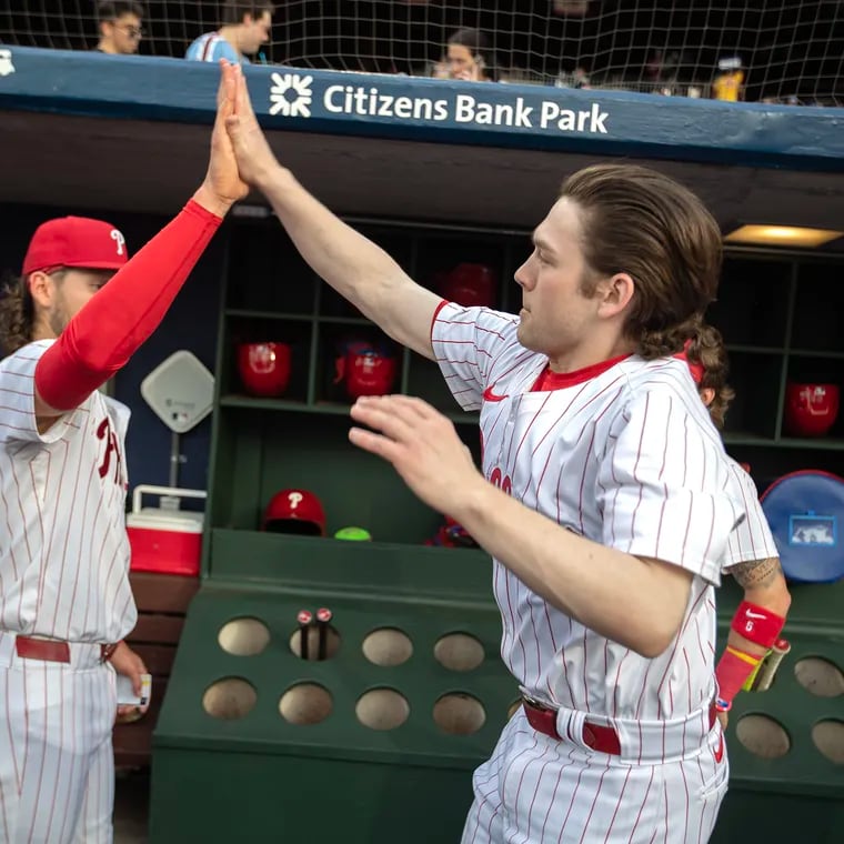Phillies bat boy Adam Crognale leaps to high-five Alec Bohm before the game against the Rangers on May 22, 2024 at Citizens Bank Park.