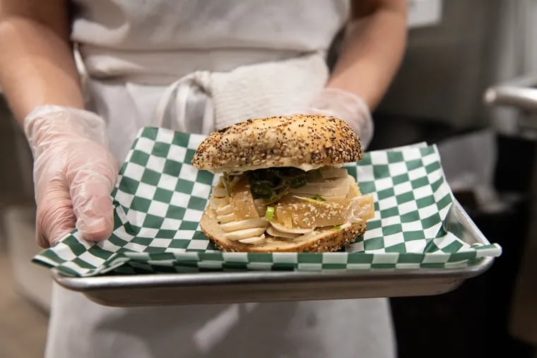 The “Ramen thing,” a popular sandwich at Cleo Bagels that includes marinated egg, pickled ginger and a seaweed crisp, pictured during the grand opening on Sept. 9, 2023 in Philadelphia, Pa. The bagel shop, formerly known as Dodo Bagels, began in a West Philadelphia kitchen over the winter of 2016.