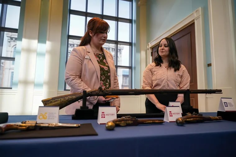 Rachel Warner (left) and Emily Immel of the York Historical Society at an event announcing the return of stolen artifacts held at the Museum of the American Revolution on Friday.