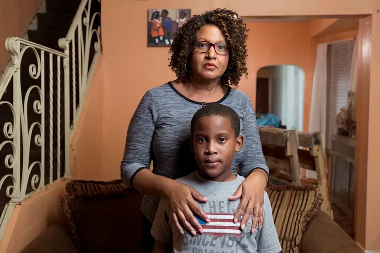 Avril Absolum and her son Jalen are shown here on October 5, 2016, at their home in Philadelphia. Jalen has developmental disabilities due to exposure to lead poisoning when he was two years old.
