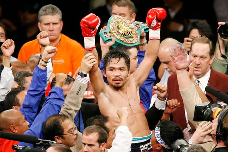 Manny Pacquiao is carried around the ring after his TKO of Oscar De La Hoya.