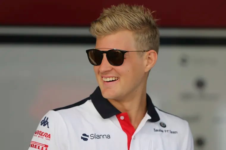 FILE - This Nov. 22, 2018, file photo shows Sauber driver Marcus Ericsson of Sweden arriving at the Yas Marina racetrack in Abu Dhabi, United Arab Emirates. After their early years racing each other in karts, Sweden’s Ericsson and Felix Rosenqvist took very different paths chasing checkered flags around the globe before finally landing in the U.S. Now they represent a “Swedish Invasion” of IndyCar as two series rookies with vast experience and big expectations heading into the 2019 season.