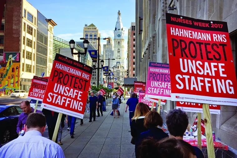 Hahnemann nurses, represented by union PASNAP, protest outside the hospital at N. Broad and Vine St. in the spring of 2017. PASNAP nurses at St. Christopher's, Hahnemann's sister institution, fear they'll lose the gains they won in their union contract after Tower Health acquires the hospital.