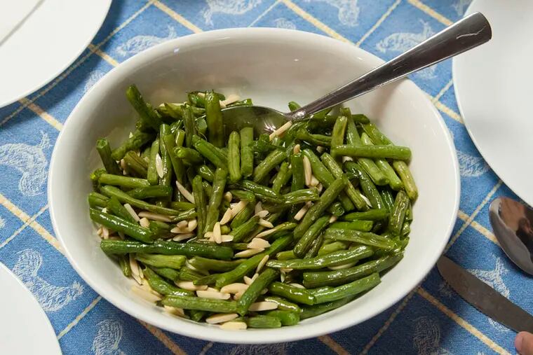 The side dish -- green beans and almonds -- to go with the main meal of quesadillas at the third week of My Daughter's Kitchen at Wiggins Elementary School in Camden on October 29, 2015.  ( CLEM MURRAY / Staff Photographer )