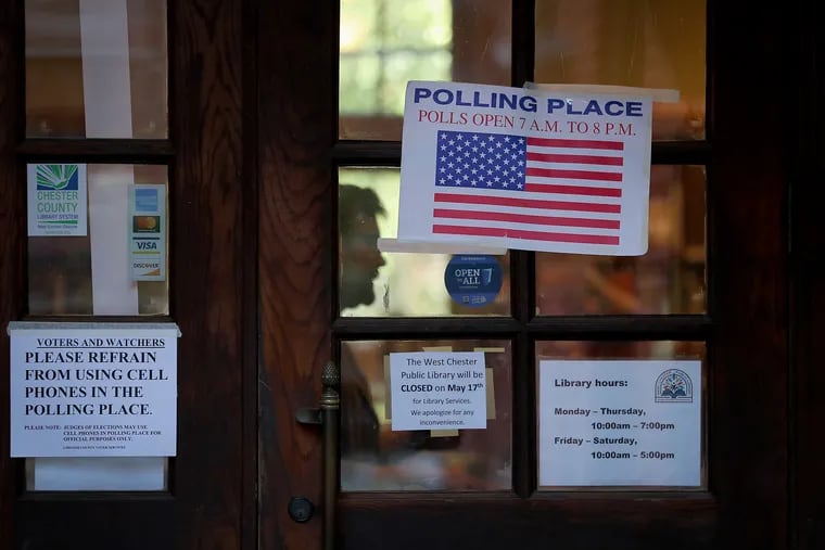 A polling place sign hangs on the door of the West Chester Library in West Chester, Pa. on Election Day, Tuesday, May 17, 2022 for the primary election.