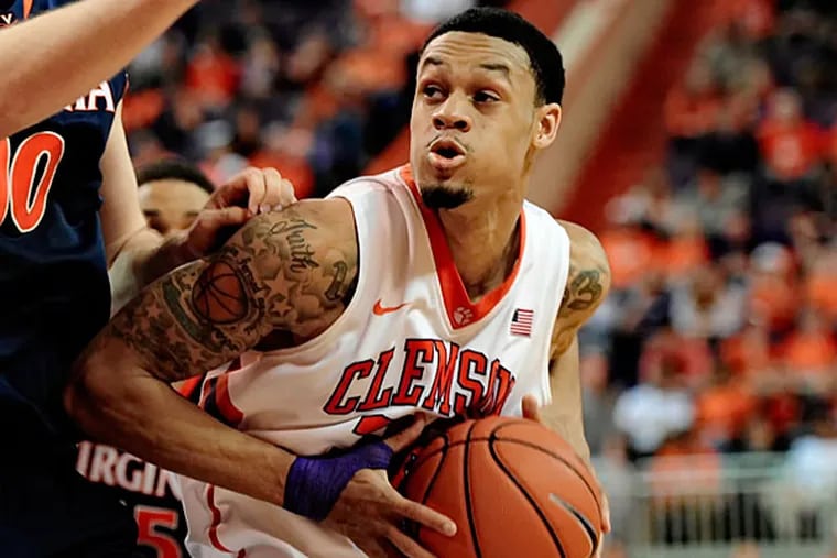 Clemson's K. J. McDaniels works against Virginia's Mike Tobey during the second half of an NCAA college basketball game Saturday, Feb. 15, 2014, at Littlejohn Coliseum in Clemson, S.C. (Richard Shiro/AP)