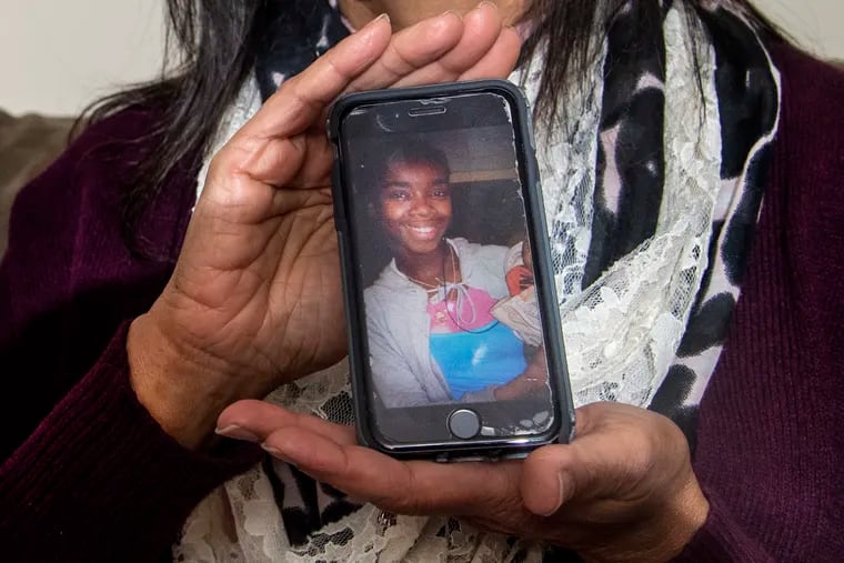 Samdai Stricklan, shows an iPhone photo of her friend Virginia Thomas, during an interview in Villanova, Pa. on Thursday, January 6, 2022. Virginia Thomas and some of her children where victims in the deadly row house fire in Philadelphia the day before.