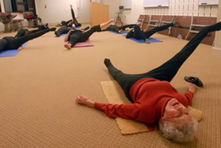 Ninety-four-year-old Hedy Tower leads stretching exercises during a dance class at Cathedral Village, a retirement community in the Upper Roxborough section of Philadelphia. &quot;I would still trade my legs for hers any day,&quot; said one of her longtime students.