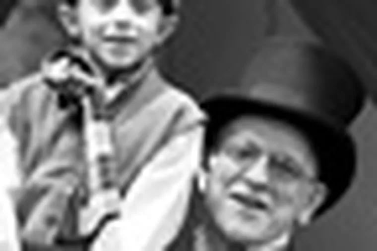 Joseph Mancini (Tiny Tim) and Benjamin Lovell (Scrooge) in Walnut Street Theatre for Kidsâ€™ production of Charles Dickensâ€™ A Christmas Carol. Photo by Mark Garvin.
