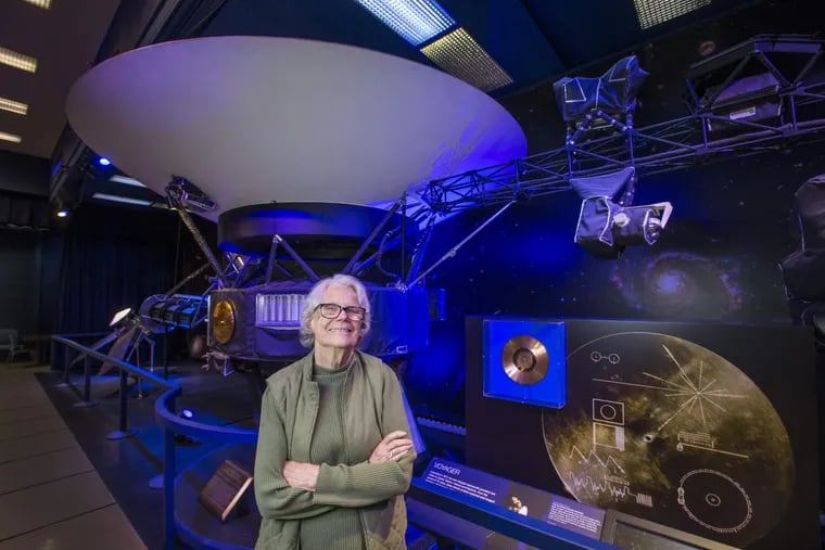 Sue Finley, 80, is photographed next to a model of the Voyager  in La Canada Flintridge, Calif. Finley is a subsystem and test engineer for NASA's Deep Space Network (DSN) and worked on Voyager in the 1970s.