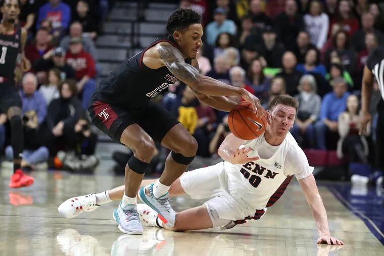 Nate Pierre-Louis, left, of Temple and Ryan Betley of Penn go after a loose ball during the 1st half at the Palestra on Jan. 25, 2020.
