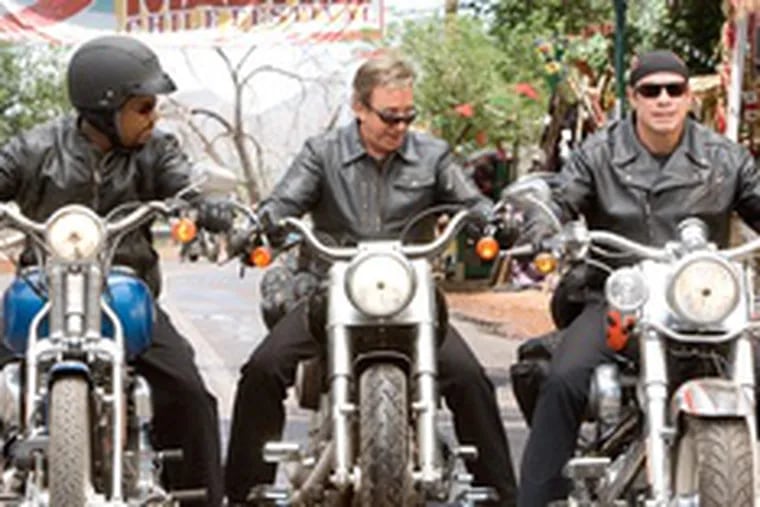 &quot;Wild Hogs&quot; Martin Lawrence (left), Tim Allen, John Travolta, firing all their guns at once. For all the gay and black jokes and cliches, it&#0039;s not bad.