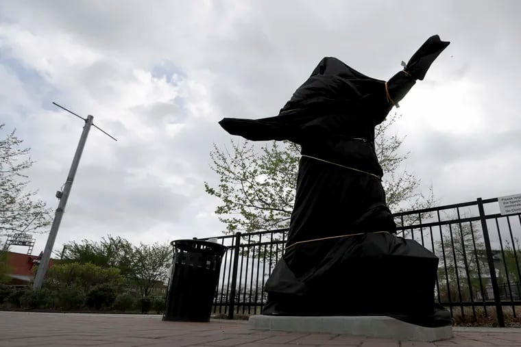 The covered Kate Smith statue stood outside Wells Fargo Center in Philadelphia on April 19. The Philadelphia Flyers covered the likeness of the  singer after the New York Yankees began looking into racist songs she had recorded in the 1930s. Flyers officials said Friday they also plan to remove Smith’s recording of “God Bless America” from their library. The Flyers said the songs “contain offensive lyrics that do not reflect our values as an organization.”  By Sunday morning, the statue had been removed.
