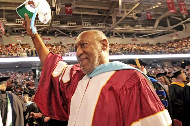 Bill Cosby doffs his hat at Temple University's May 2013 graduation. The comedian resigned from Temple University's board of trustees, a seat he has held for 32 years.