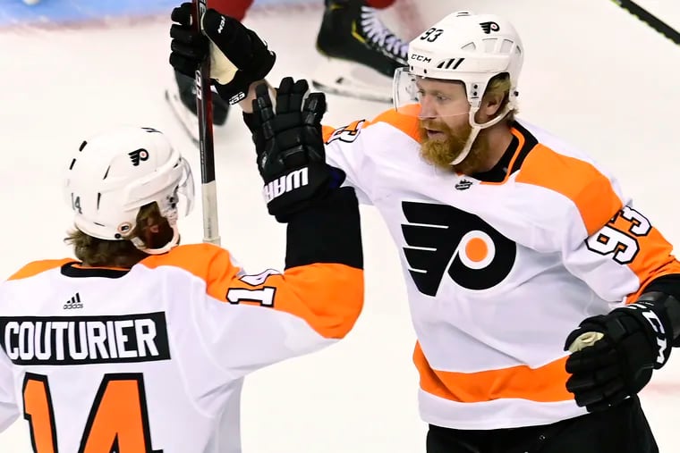 Flyers right winger Jakub Voracek (93) celebrates his goal against the Montreal Canadiens with Sean Couturier (14) during the first period of Game 3 on Sunday. The Flyers won, 1-0, to take a two-games-to-one lead in the series.