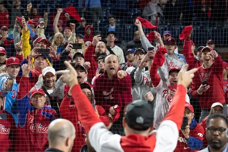Fans reacting to Zack Wheeler of the Phillies as he walked off the field after winning the NLCS at Citizens Bank Park.