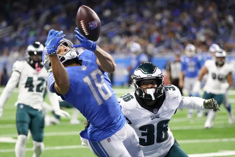 Detroit Lions wide receiver KhaDarel Hodge attempts to catch the football past Eagles cornerback Tay Gowan in the fourth quarter on Sunday, October 31, 2021 in Detroit.